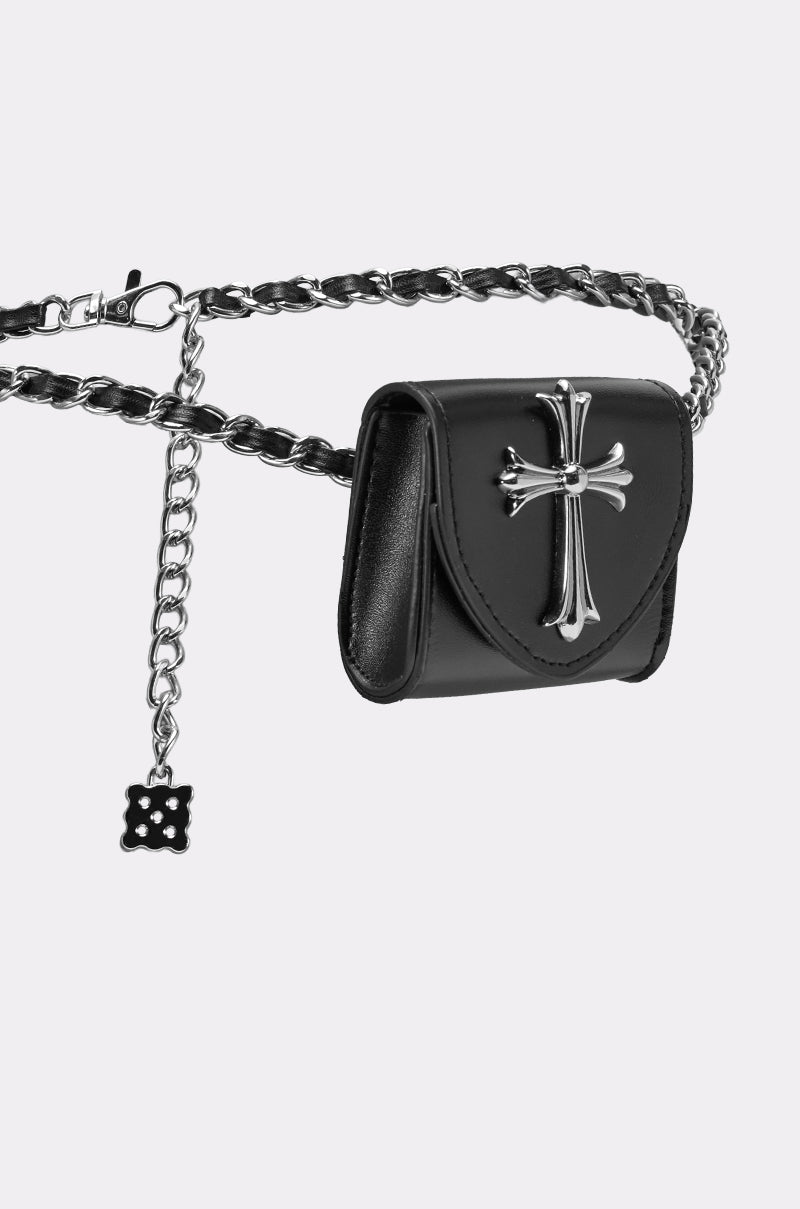 The CALL ME CHROME BELT BAG features black faux leather with a bold silver cross on the flap and a chain belt strap intertwined with black leather. A small square charm hangs from the chain for an edgy finish. 5