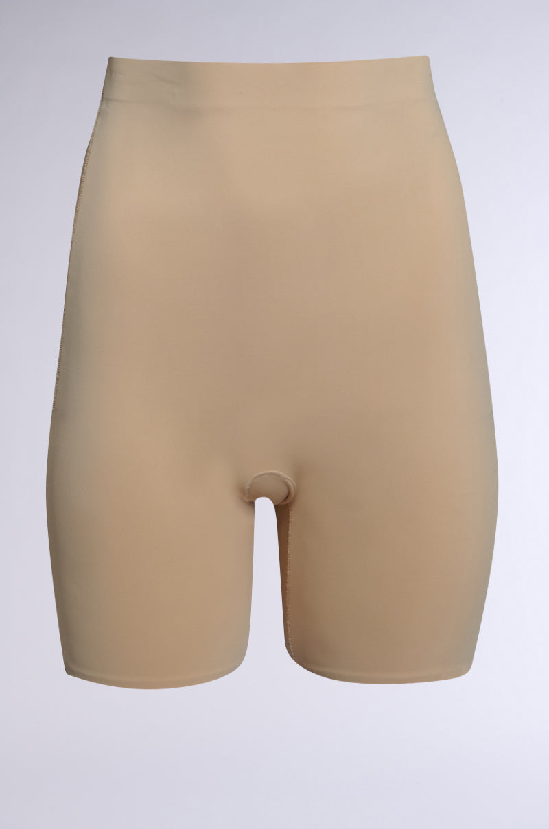 The TITSY TUMMY TUCK SHORTS in tan feature a high-rise fit and seamless hems for smooth body contouring, displayed against a plain, light gray background. 1
