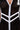 Close-up of a person wearing the LUCKY NUMBER 7 MAXI DRESS, a varsity-style black mesh zip-up dress with white trim, geometric patterns, and a large white number patch on the upper left side.