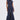 A woman wears the DONT MESS WITH ME COLLARED DENIM MAXI DRESS, a sleeveless navy collared piece with a front zipper and utility pockets, standing facing forward against a plain white background.