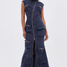 A woman wears the DONT MESS WITH ME COLLARED DENIM MAXI DRESS, a sleeveless navy collared piece with a front zipper and utility pockets, standing facing forward against a plain white background.