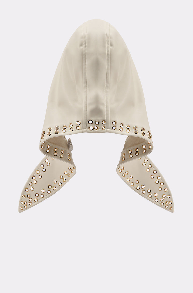The THAT GURL PU GROMMET HEADSCARF is a cream-colored, streetwear-inspired hood featuring wide, pointed sides and grommet details on the edges and hem, shown against a plain white background. 3