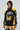 Wearing the MADE EXTREME OVERSIZED BOMBER with black and yellow colorblock, "Made Extreme" and a large "M" on the front, plus sleeve embroidery, they strike a pose against a neutral backdrop.