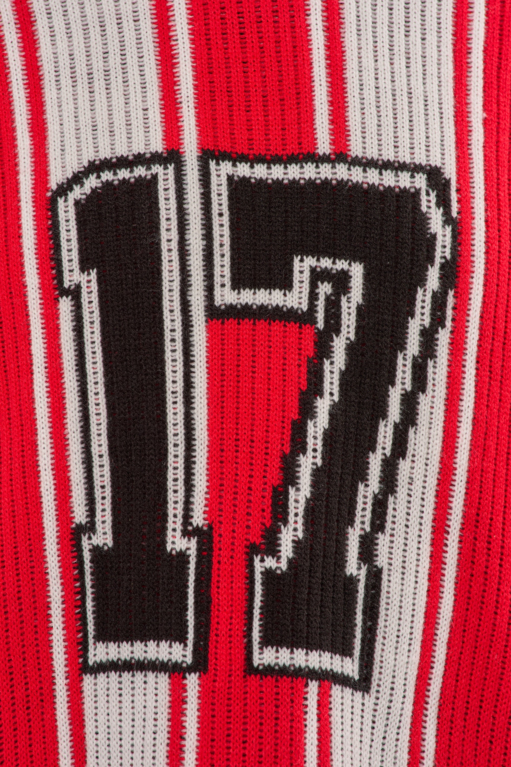 The THROW SUM MO KNIT JERSEY TOP features the number 17 in bold black and white on vertically striped red, white, and black fabric. 8