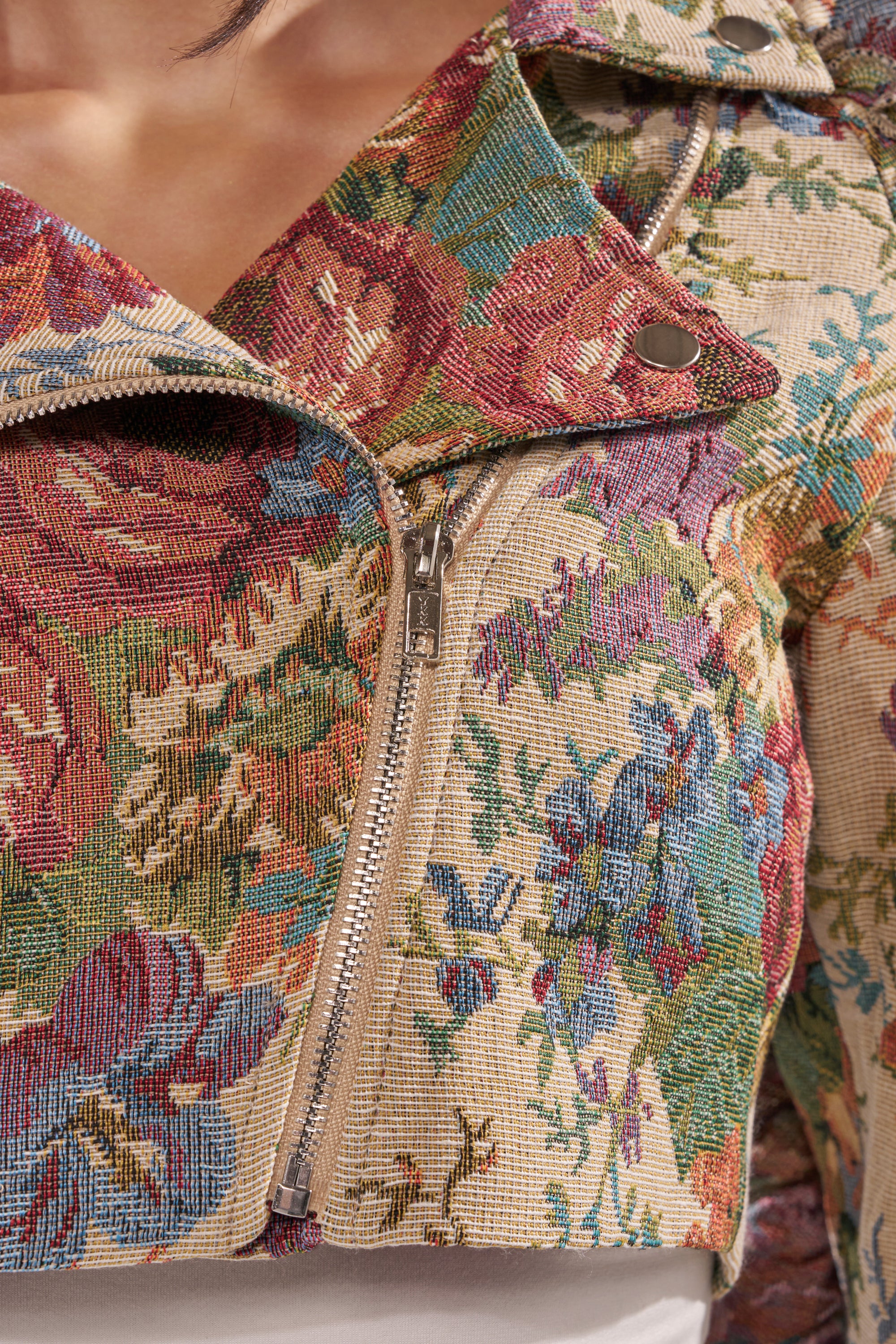 A close-up of the MAKE IT LOOK EASY TAPESTRY MOTO cropped jacket. 11