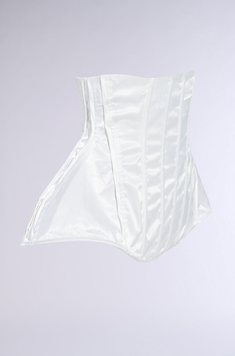 The IM TOO GOOD FLARE BELT is a sculptural white satin corset with structured boning, an asymmetric peplum silhouette, and flowing panels, displayed against a plain light gray background. 3