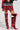 A person wearing red and black knee-high lace-up boots with intricate patterns, paired with a mini skirt showcasing plaid elements from the CALL ME BACK DENIM SKIRT WITH PLAID DETAIL, featuring layers of red, blue, and gold. The look is completed with a cropped leather jacket.