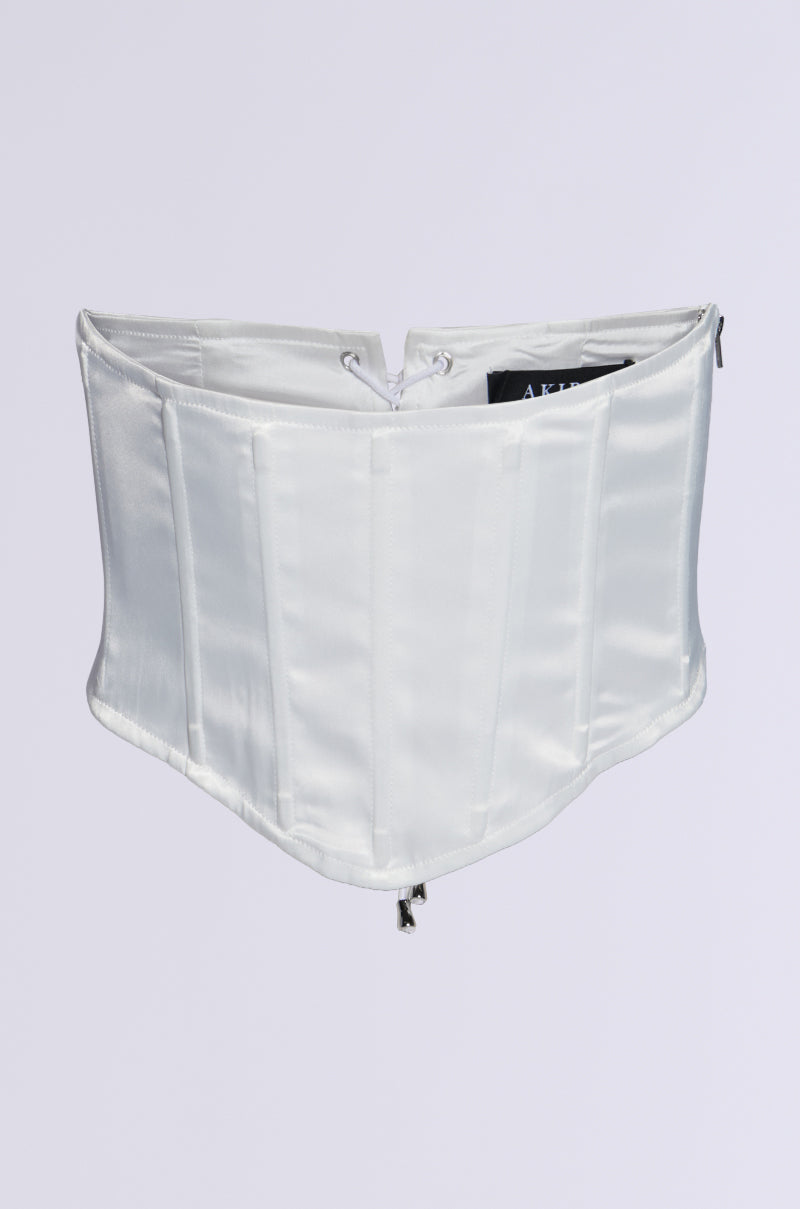 The PAIR ME CORSET BELT is a white satin accessory with boning detail and a front zipper. Its structured, fitted design in stretchy satin showcases a subtle sheen, complete with a lace-up back for easy adjustments. A simple background highlights the corset belt as the image's main focus.