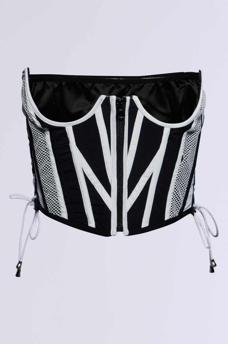 The TO THE RACES NYLON BELT from the AKIRA Label showcases a sleek black strapless design embellished with white geometric patterns. It includes a central zipper and adjustable side laces. The belt's colorblock design, paired with mesh panels, creates curved lines that stand out against a plain white background for a contemporary style. 0
