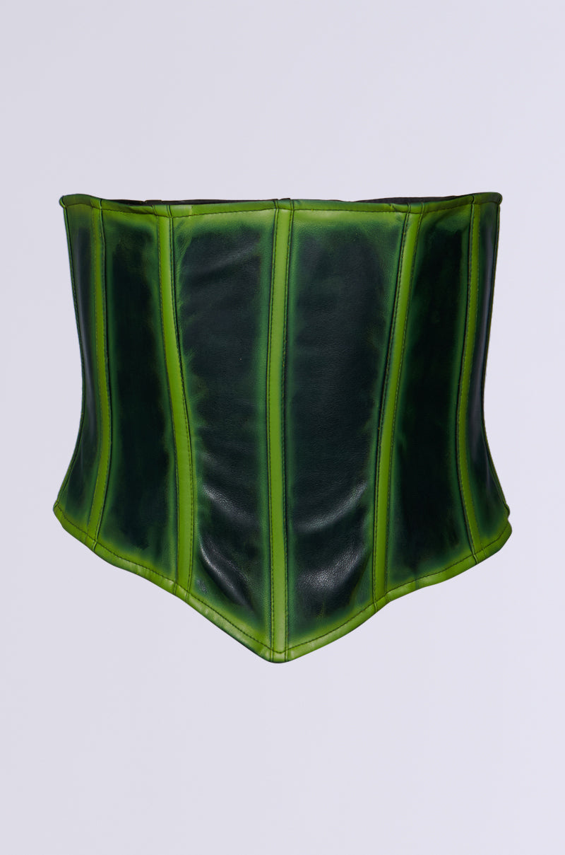 The CHARLI GREEN SPRAY CORSET BELT is a green faux leather accessory featuring a vertical panel design with gradient dark and light shades. Its smooth, glossy finish enhances the leather texture against a plain gray background.