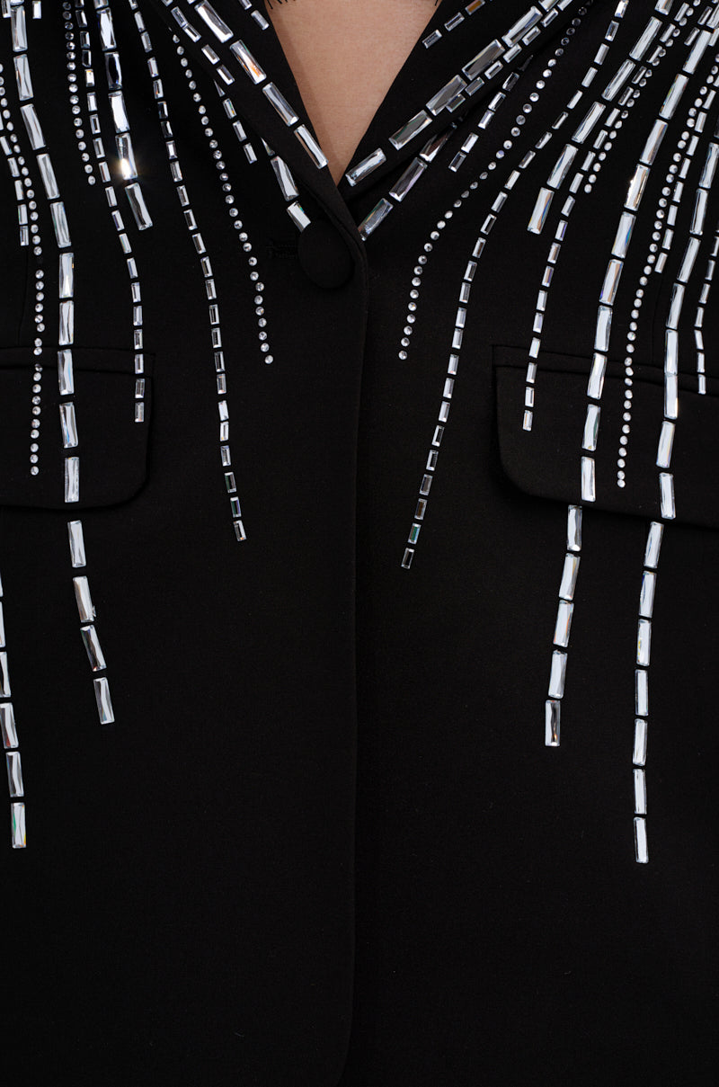 Close-up of the MILA EMBELLISHED BLAZER IN BLACK, featuring cascading rows of small, rectangular and round silver beads arranged in vertical lines across the fabric.