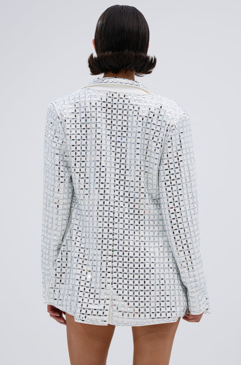 A person with short dark hair is shown from behind, wearing the WHITE HOT EMBELLISHED BLAZER with a notch lapel collar and mirrored embellishments, against a plain light gray background.