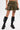 Wearing the DARIA STUDDED CAMO MINI SKIRT with gold-tone studs and black knee-high lace-up boots, a person stands against a plain white background, hands by their sides and showing a tattoo on their left thigh.