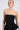 A person with blonde hair pulled back wears the LADY FRIEND CORSET, a strapless black dress featuring a structured bodice, corset detailing, and peplum. The backdrop is a plain light gray.