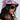 A person wearing the $100 "Money on My Mind" bucket hat with a collage pattern, dark sunglasses, and a black top. They have long dark hair and a silver necklace with assorted pendants against a plain light background.