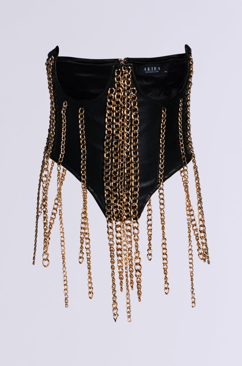 The OUT ALL NIGHT CHAIN CORSET BELT features a black velvet design embellished with cascading gold chain accents, exuding luxurious elegance as they drape from the neckline. The label "AKIRA" is visible on the upper inside against a plain light gray background.