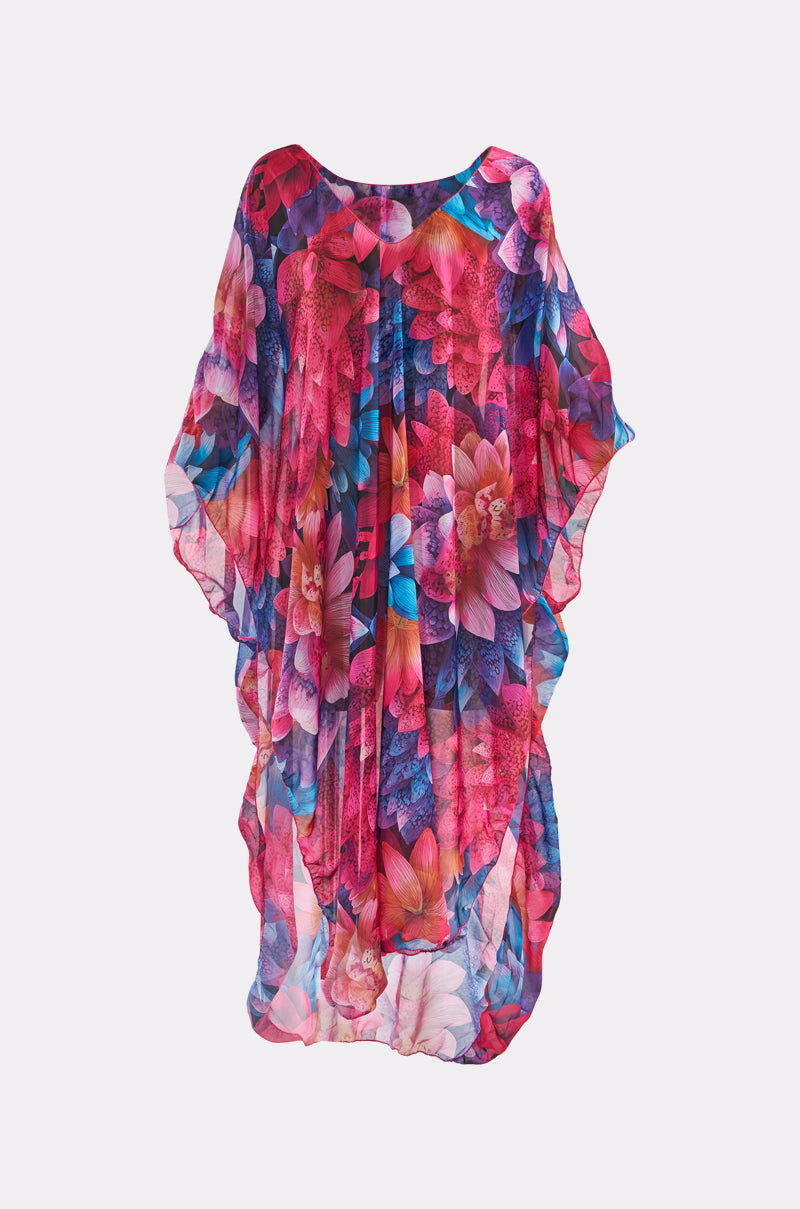 The IM RICH KAFTAN is a flowing dress featuring a vibrant multicolored floral pattern in pink, purple, blue, and orange on sheer, lightweight fabric. 2