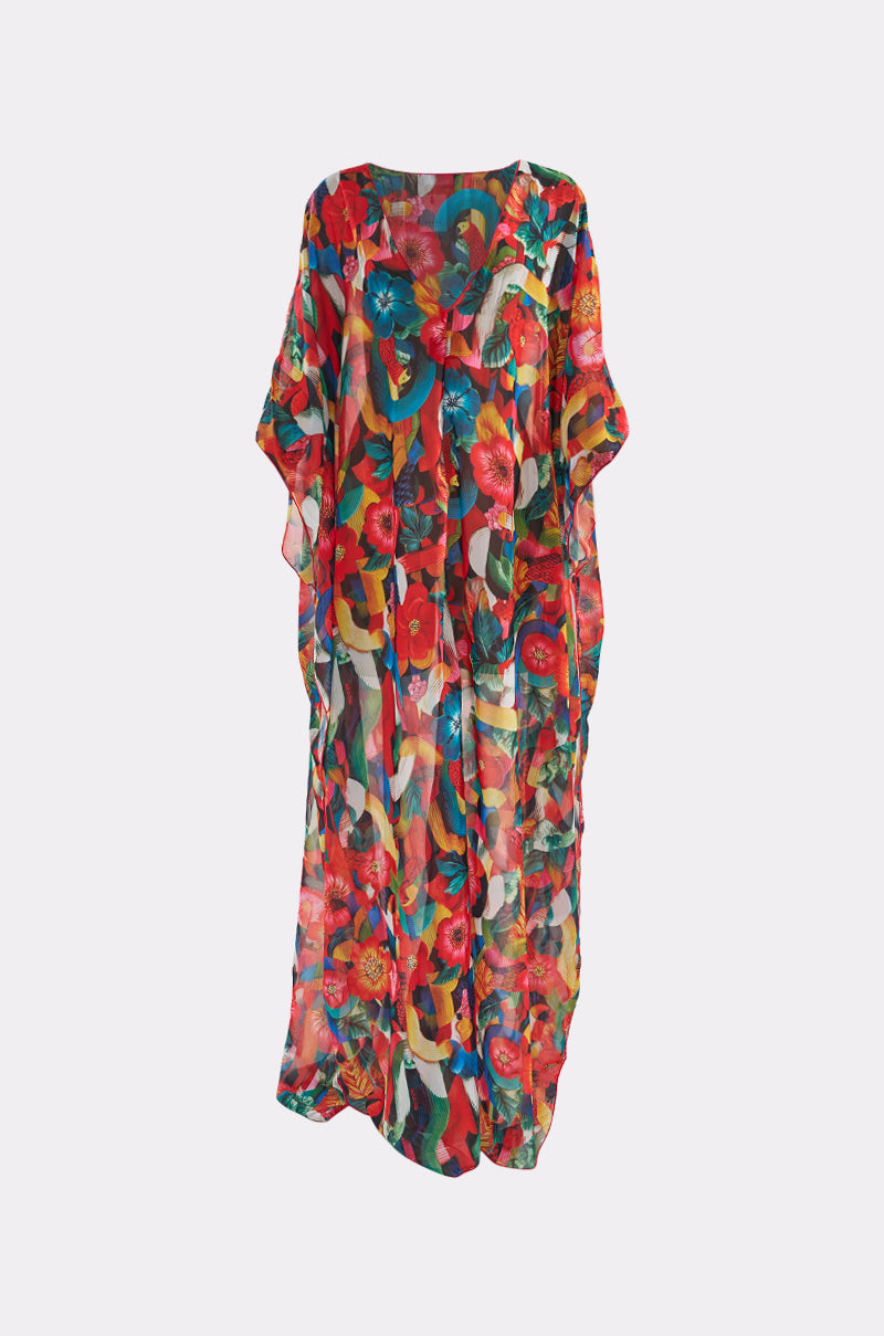 The SWEET LIFE KAFTAN is a colorful, loose-fitting piece featuring vibrant floral and abstract patterns in red, green, blue, and yellow on sheer fabric, shown against a plain white background. 3