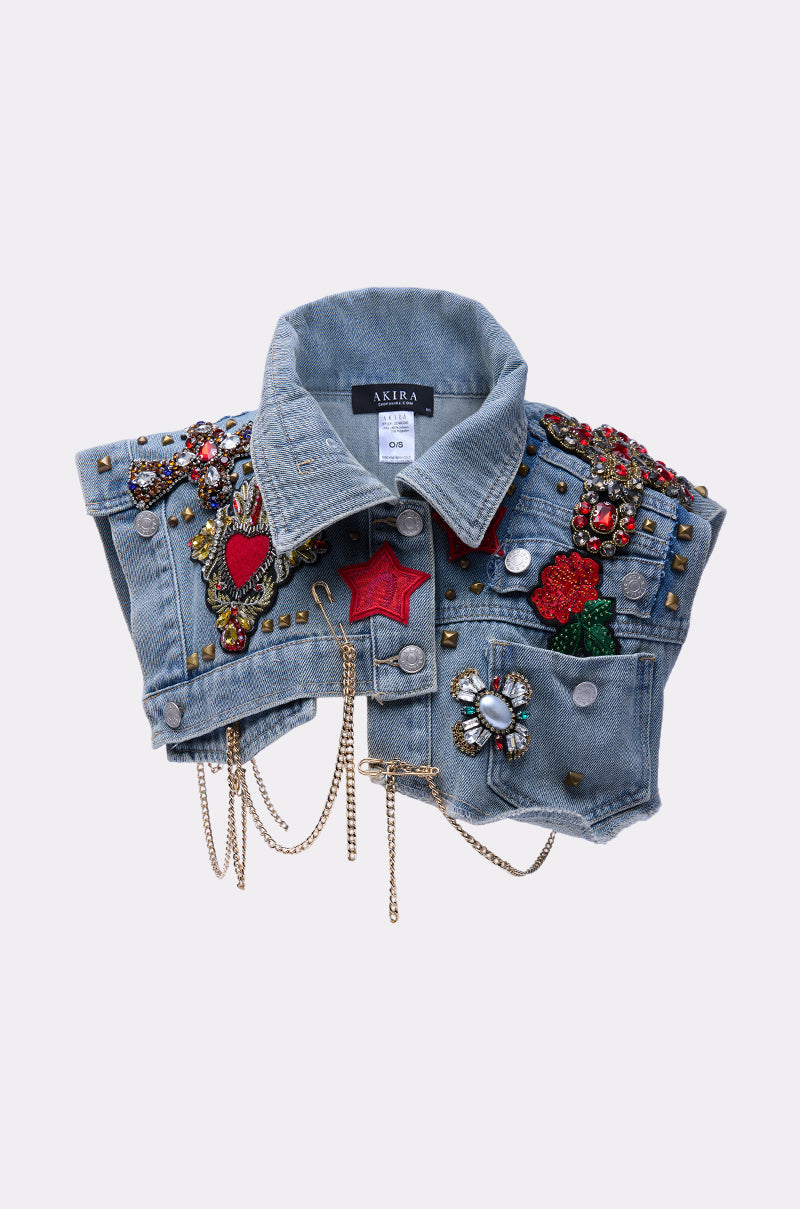 The STYLE ME UP DENIM COLLAR is a cropped blue denim jacket with classic collar, decorated with colorful embroidered patches, beads, gemstones, studs, rhinestones, gold chains, and ornate flower, heart, and star details.