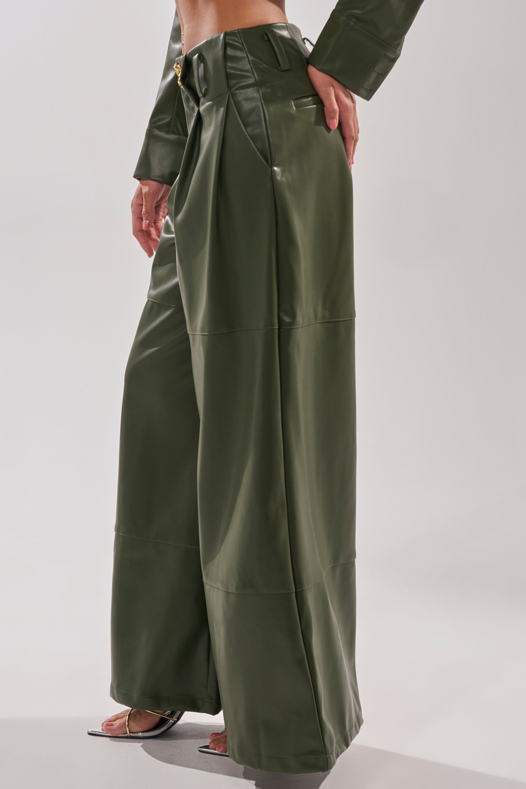 A person wears the REMEMBER YOU WIDE LEG TROUSER in olive green with a matching top and black open-toe heels, standing against a light background. 3