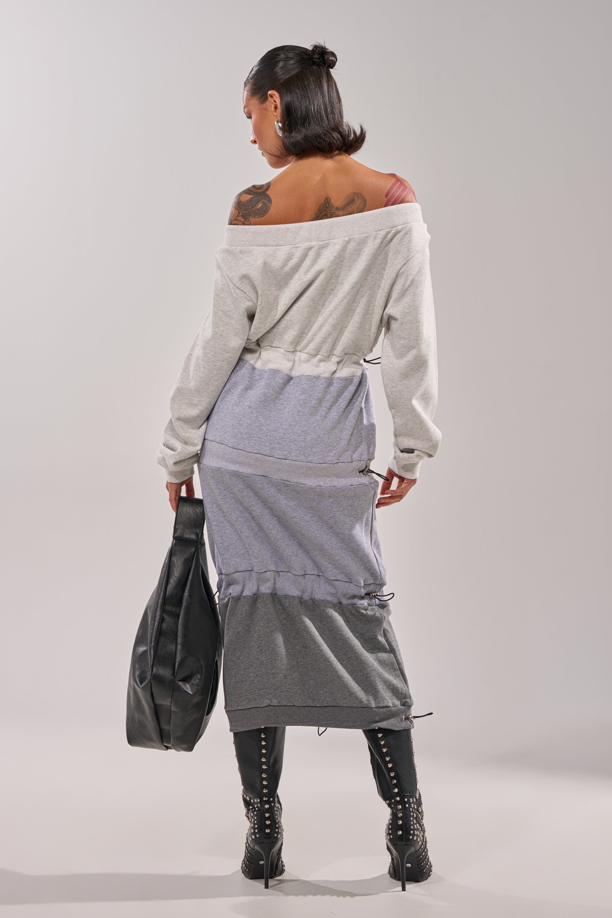 A woman in the TIED UP RIGHT NOW MAXI DRESS. 4