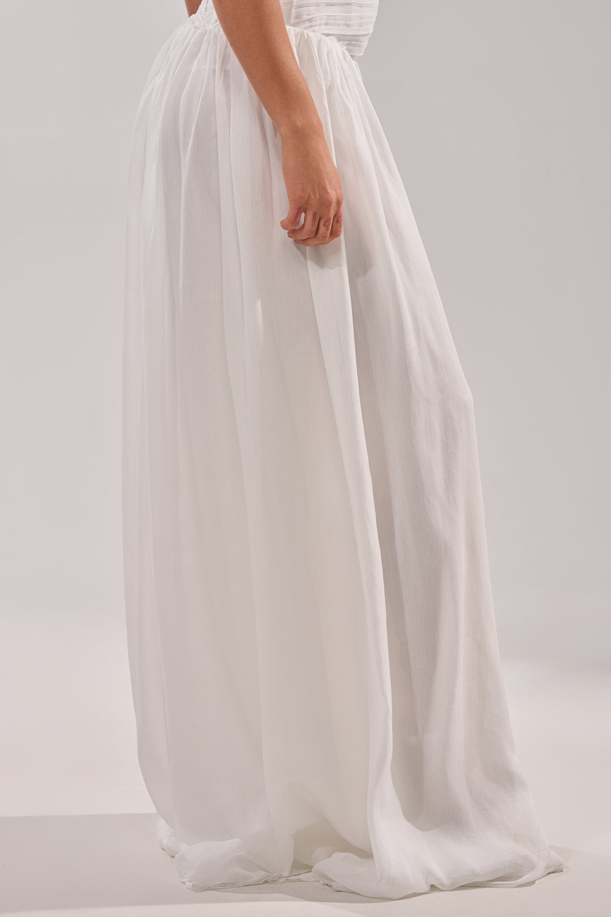 Wearing the BEAUTIFUL WHITE PALAZZO PANT with a stylish dress creates a chic and effortless look. 2