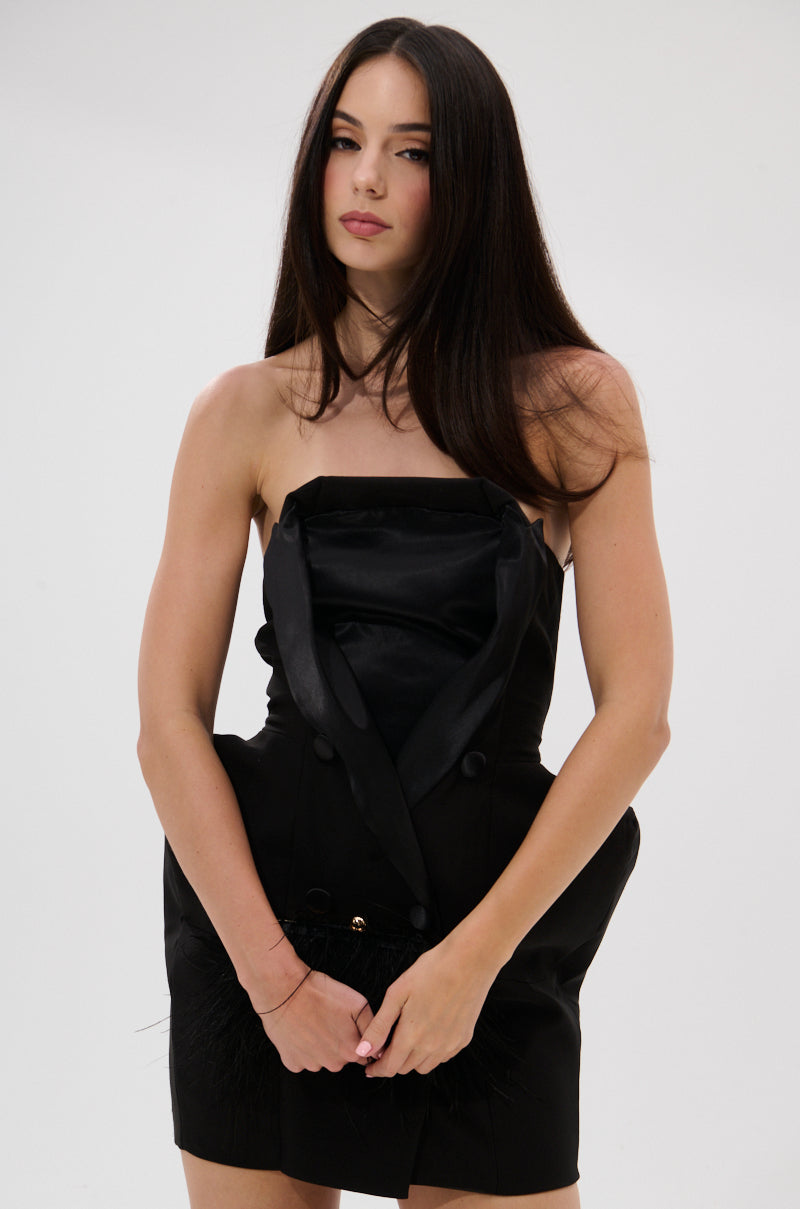 A woman with long, straight dark hair models THE MAIN EVENT SUITING MINI DRESS—a structured mini dress with a satin finish—posing against a plain white background and looking at the camera with a neutral expression.