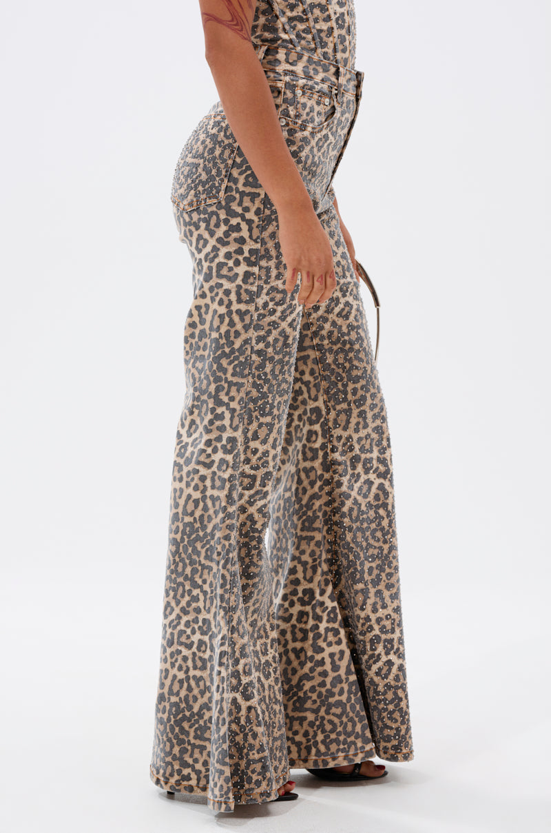 A model in a side pose showcases the IN THE WILD WIDE LEG CHEETAH PANT with a high waist against a white background.