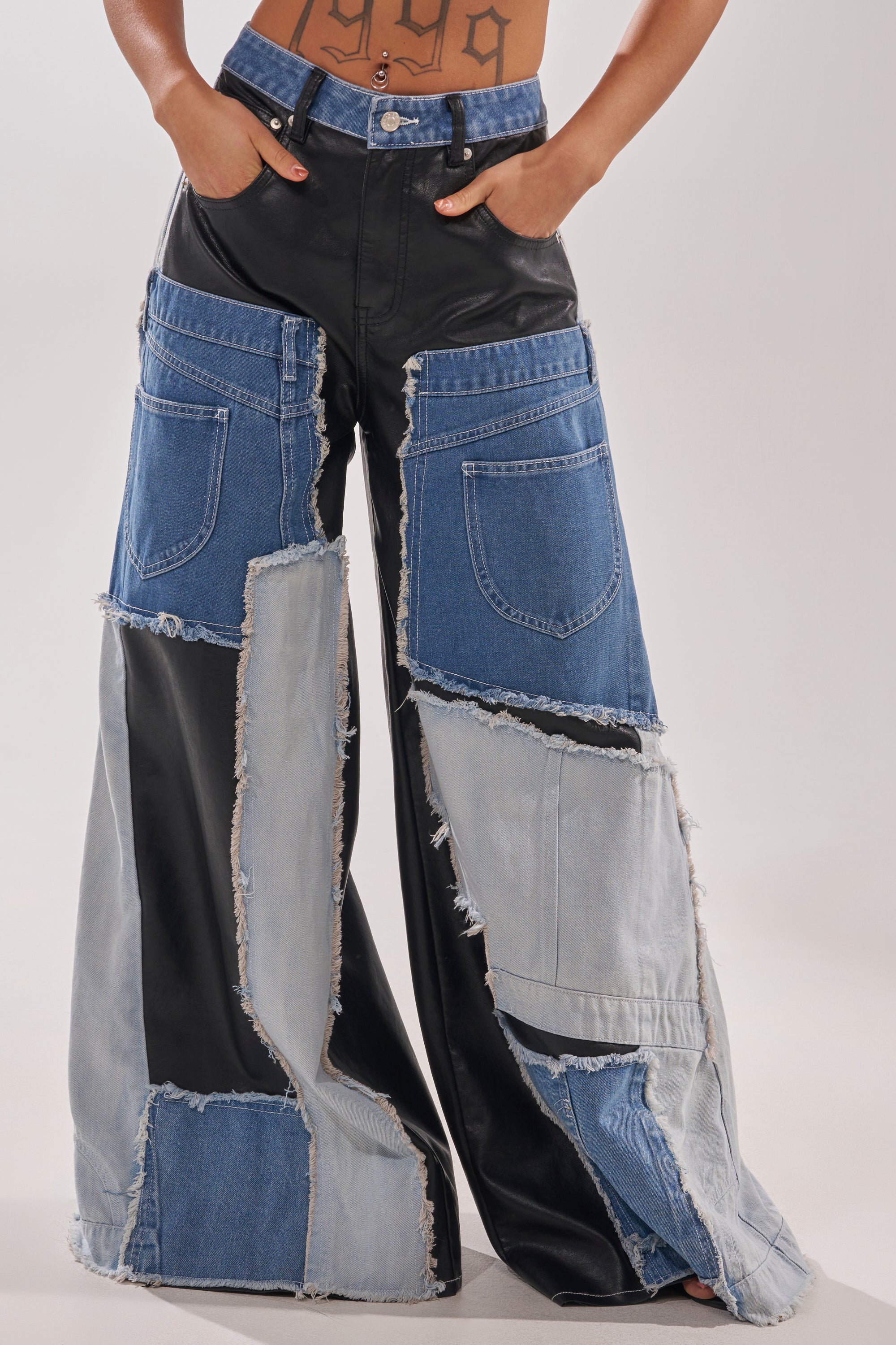 A person showcases street style in the TOO MUCH GOING ON RELAXED DENIM pants. 3