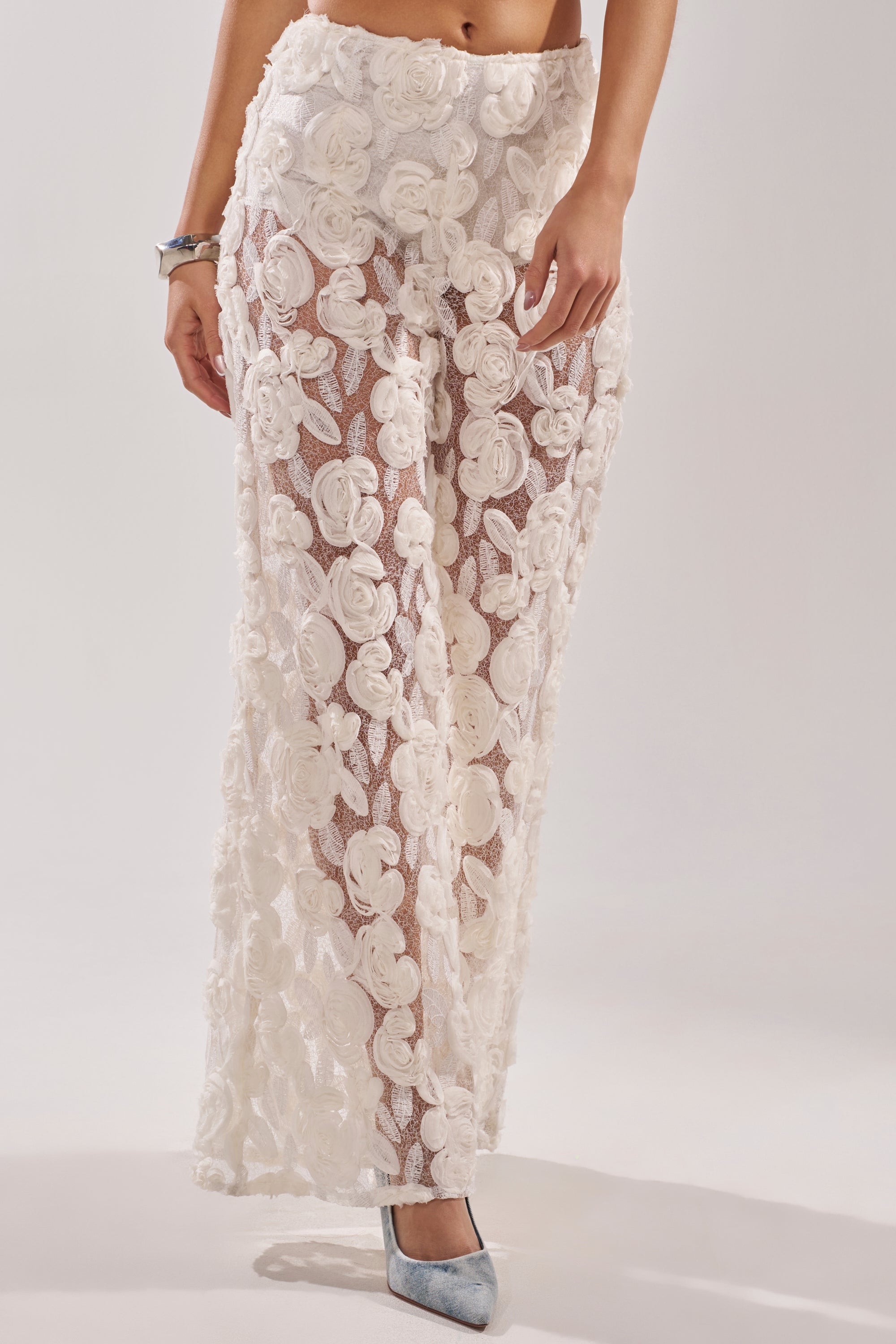 A woman wearing the CRYSTAL PALAZZO PANT.