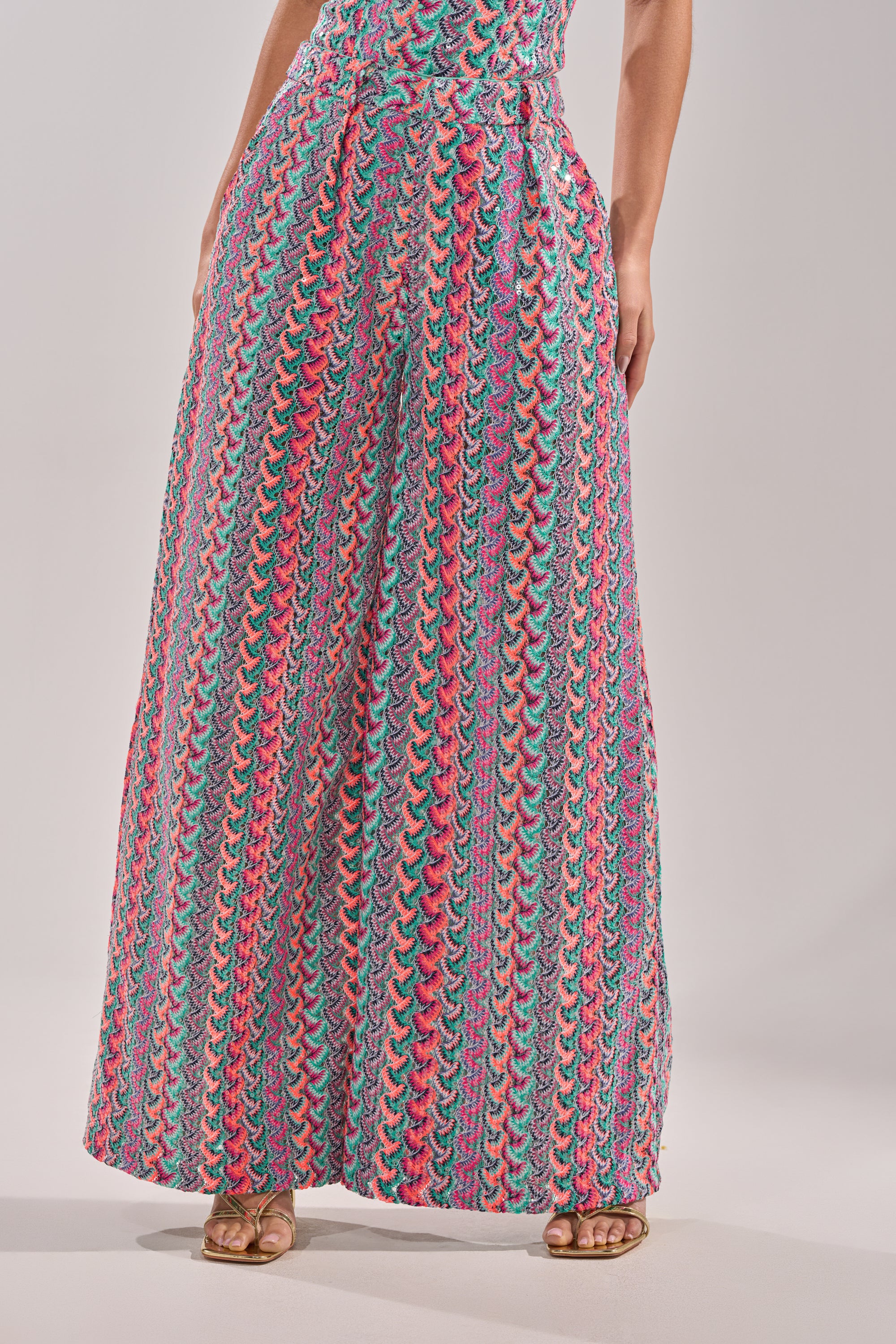 A woman wearing vibrant vacation wear featuring the COASTAL BABE TROUSER. 5