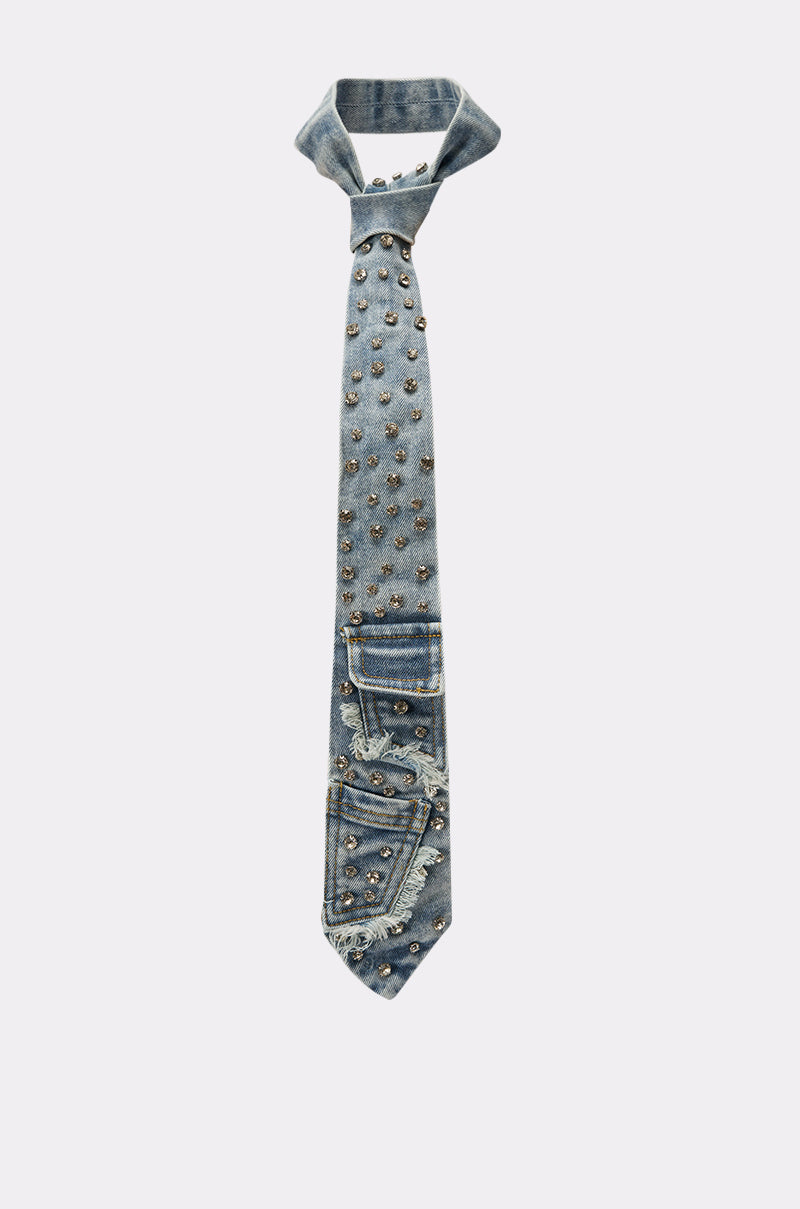 The DENIM AND DIAMONDS TIE is crafted from blue denim with cargo pockets, metal studs, jean-style accents, and frayed edges, showcased on a plain light background. 4