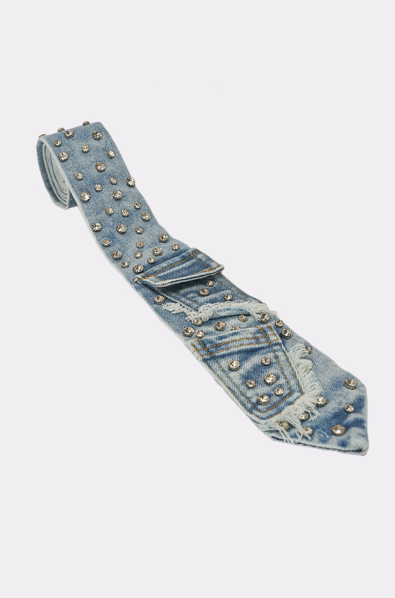 The DENIM AND DIAMONDS TIE, featuring light blue denim, silver studs, rhinestone accents, and frayed edges, is displayed on a white background. 5