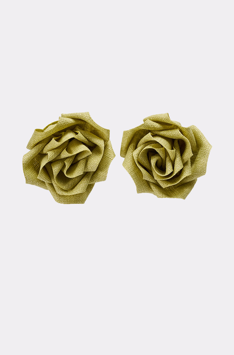 Two light green AT BRUNCH EARRINGS made from woven textured fabric, featuring layered, textured petals, are displayed side by side on a plain white background. 3