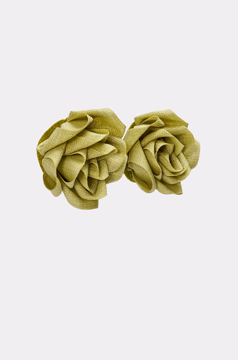 The AT BRUNCH EARRING features two light green fabric roses with textured petals, set side by side on a plain white background, creating the perfect floral statement stud earrings. 4