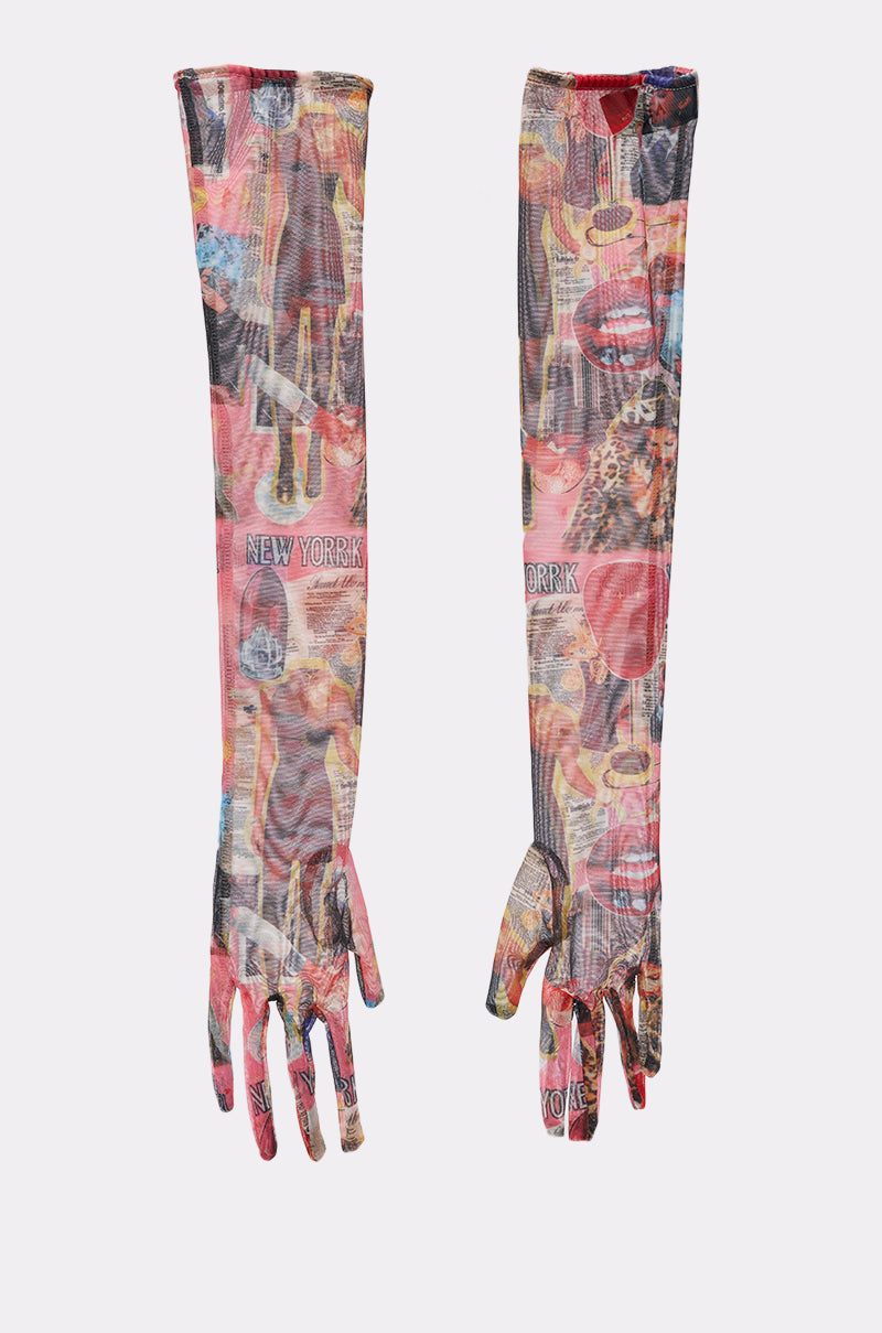 The IN THE ZINE MESH GLOVES are sheer, long gloves with a bold New York collage in red, yellow, and black. These fitted gloves reach above the elbow and feature an artistic printed design. 3