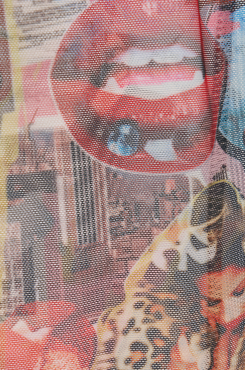 The IN THE ZINE MESH GLOVES feature a textured sheer mesh with a vibrant collage-style print of red lips, a studded tongue, cityscape motifs, and animal patterns in an abstract design. 5