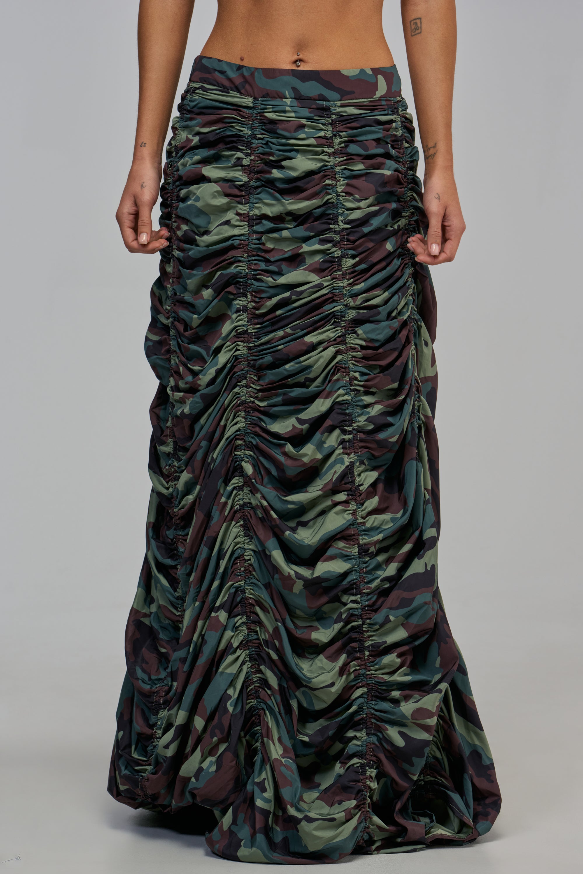 COOL IT CAMO MAXI SKIRT in a floor-length silhouette with adjustable vertical ruched detailing down the front for streetwear styling.