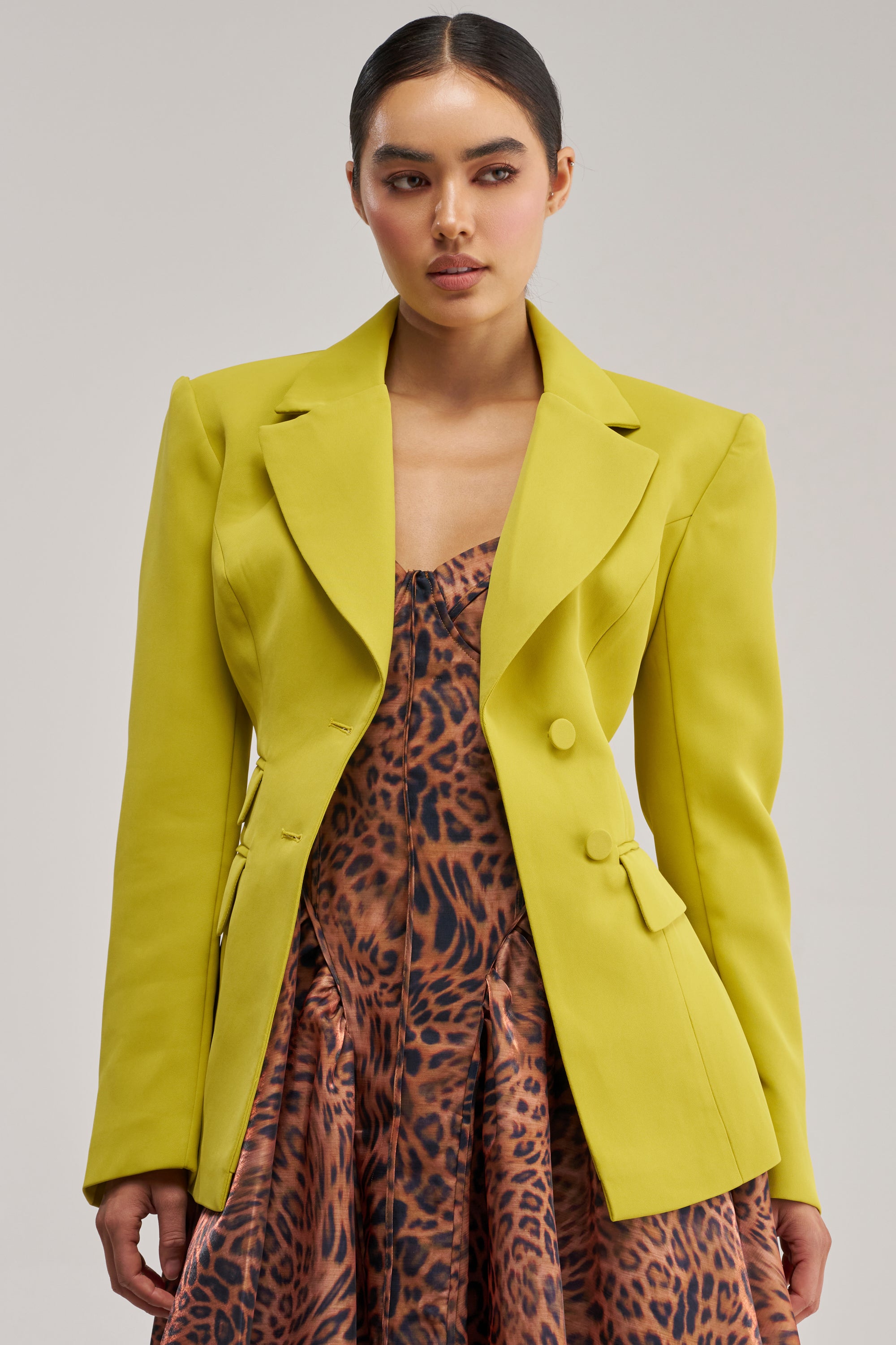Light-wash barrel-leg jeans styled with chartreuse blazer
