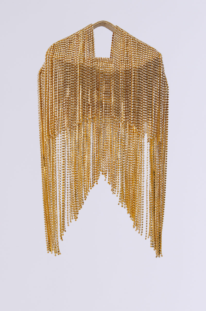 Introducing the ULTIMATE LUXE BLING PURSE, this exquisite accessory shines with its golden chainmail-style design and cascading rhinestone fringe, elegantly draping in a U shape against a plain white background.