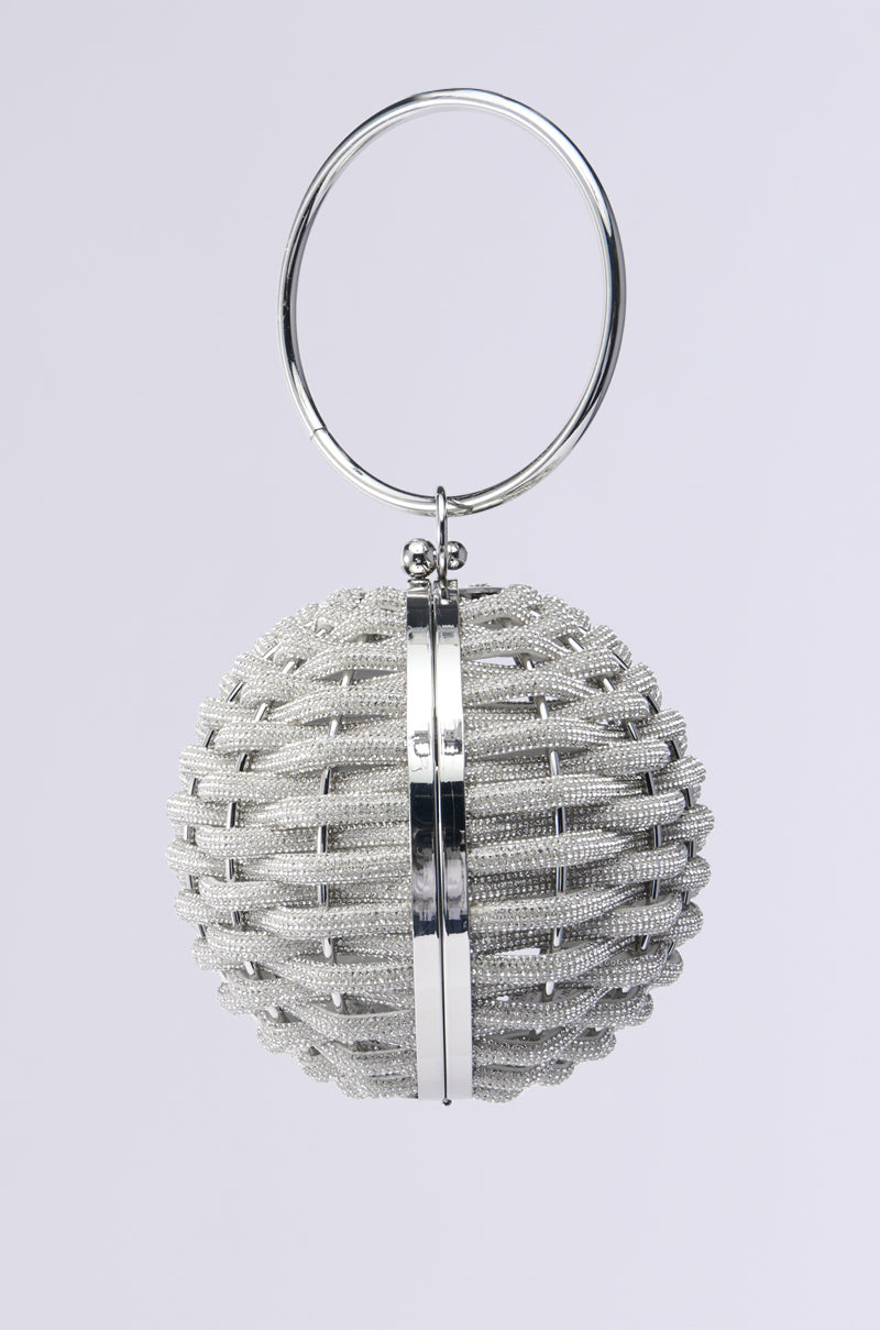 The DIAMONDS DRIPPIN SPHERE PURSE keychain is spherical and silver, featuring a textured, woven-like surface with a shiny metallic stripe reminiscent of luxury handbag details. It hangs elegantly from a circular ring against a plain light gray background.