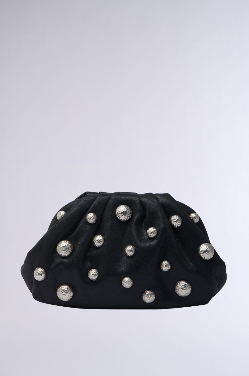 The GIGI EMBELLISHED CLUTCH showcases a gathered style with scattered silver studs on a simple white background.