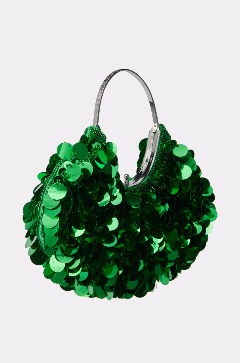 Stand out with the GREEN WITH ENVY SEQUIN PURSE—a small handbag sparkling with green sequins and finished with a sleek silver handle, perfect against any simple background.