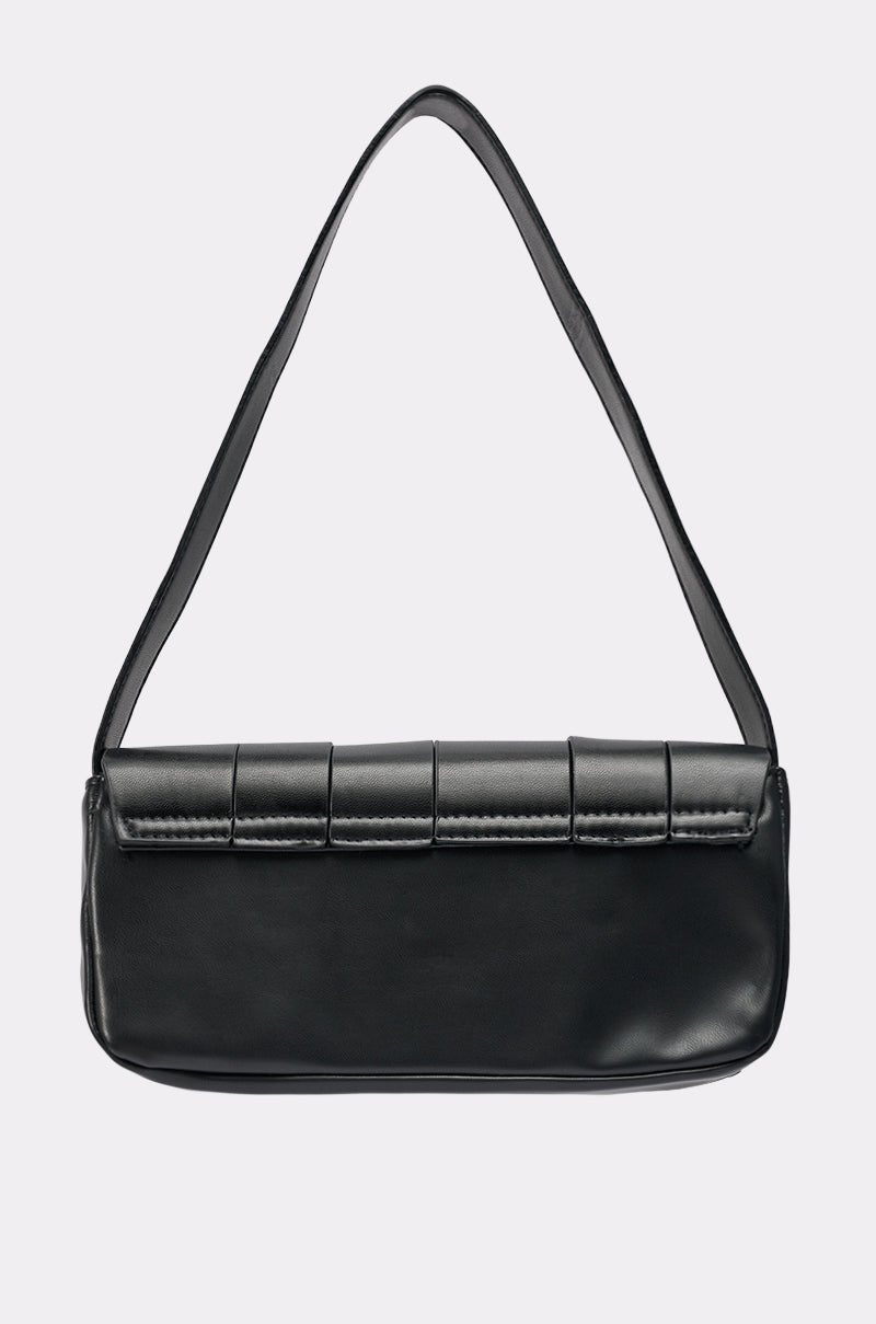 The BUCKLE UP PURSE is a black rectangular shoulder baguette bag with a single strap and flap top, featuring stitched rectangular accents, displayed against a plain light background.
