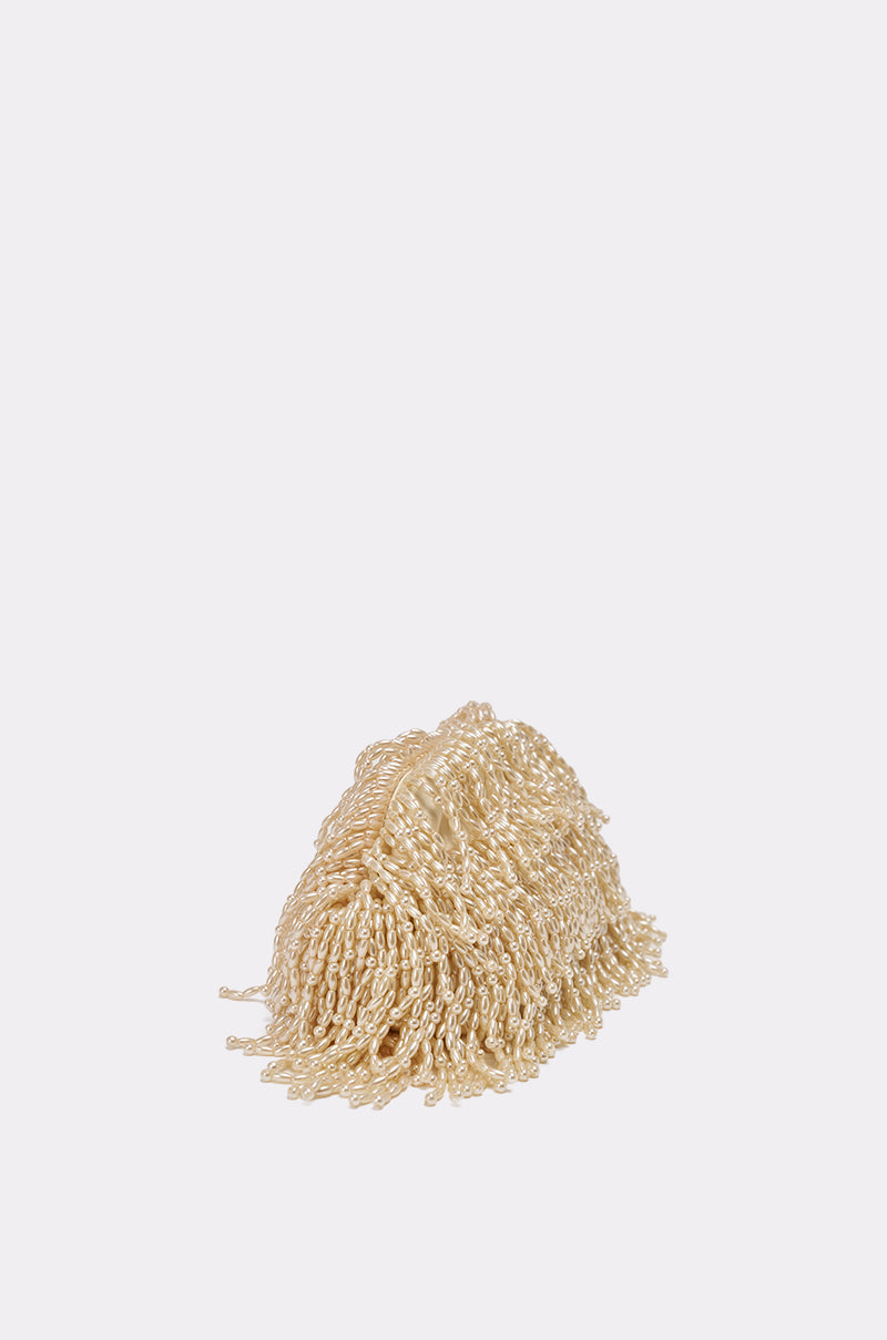 The ON AN ISLAND PEARL CLUTCH is a small, oval-shaped evening bag adorned with gold beaded fringe for a shimmering, textured look—perfect as a wedding accessory—displayed on a plain light background. 2