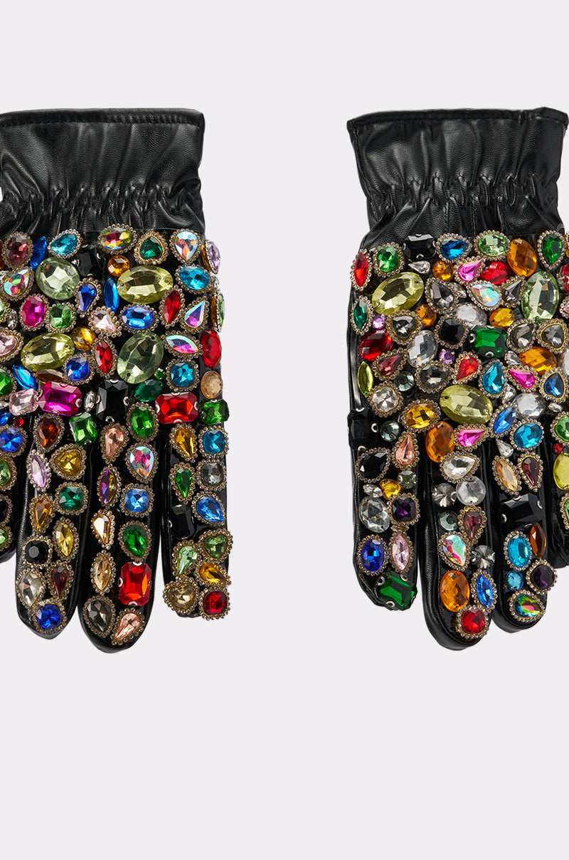 LOVE YOU BLING GLOVES: Black faux leather gloves adorned with large, colorful gemstones in various shapes, densely covering the fingers and backs, displayed on a plain light background. 4
