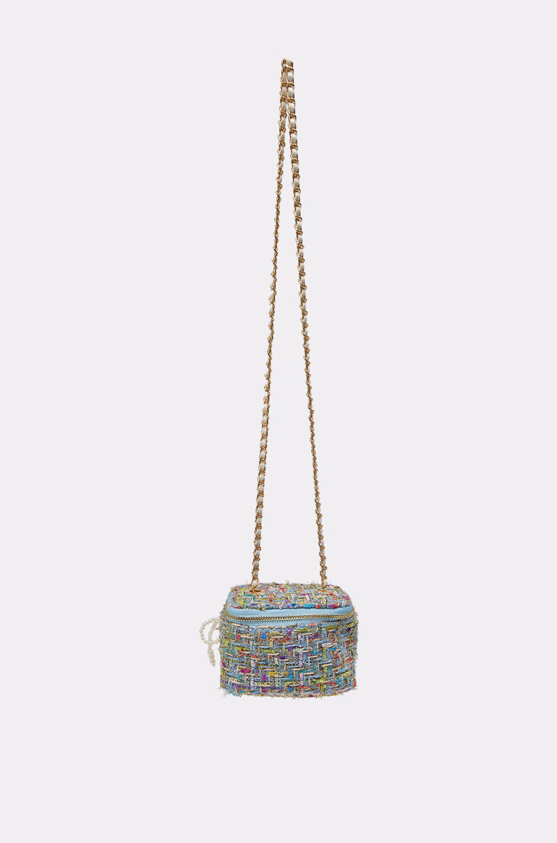 The I HAVE CLASS TWEED PURSE is a small, rectangular pastel crossbody bag with a long gold chain strap, shown against a plain light background. 4