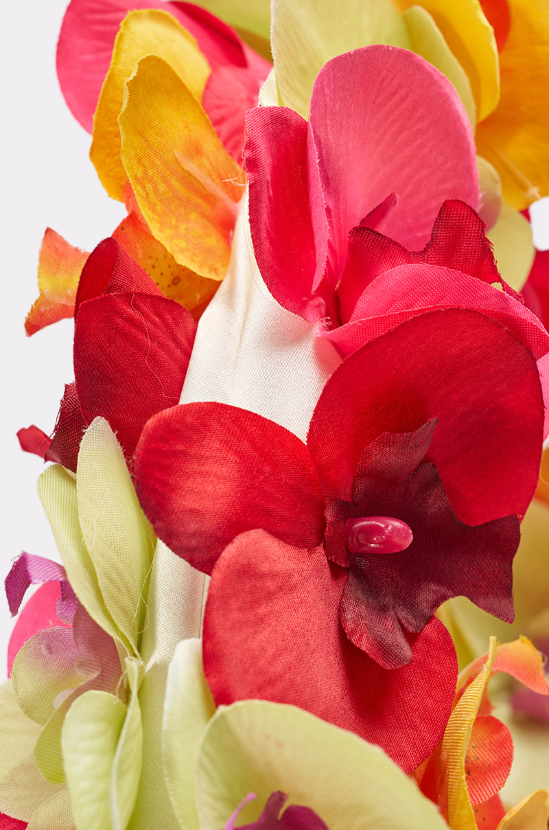 A close-up of vibrant red, pink, yellow, and green artificial fabric flowers with visible petals on a white background—perfect inspiration for the ORCHID LOVE PURSE, a lively floral accessory for summer. 3