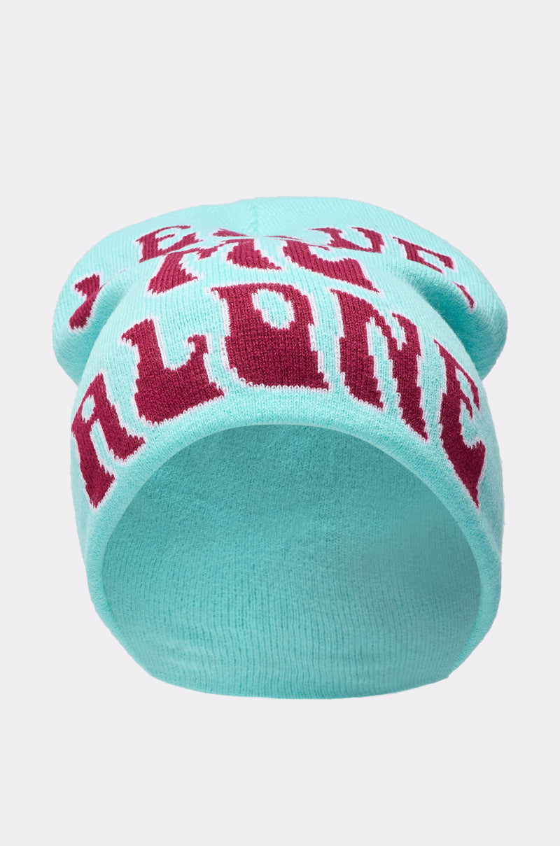 A light blue LEAVE ME ALONE BEANIE with bold red lettering on the front. This stretchy knit beanie is shown against a plain, light-colored background. 2
