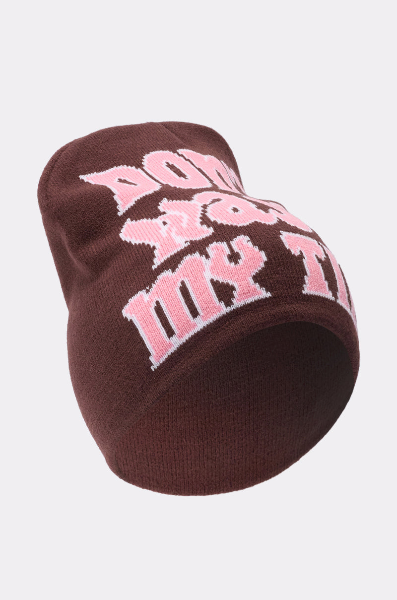 The IM SO FORREAL BEANIE from AKIRA Label is a brown knit hat with large, bold pale pink text on the front reading “Don’t waste my time,” making it stand out against light backgrounds. 4